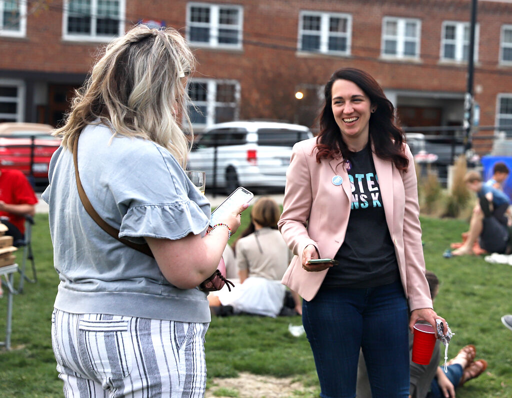 Katherine Sasser talks with her friend
